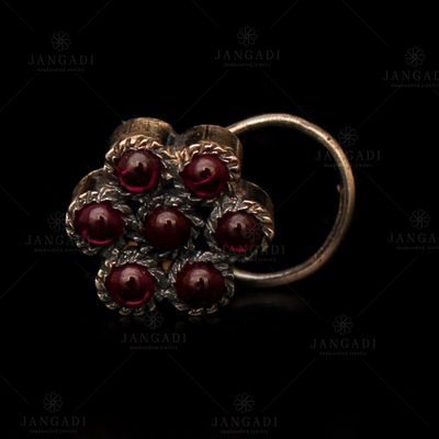 OXIDIZED SILVER FLORAL NOSE PIN WITH RED CORUNDUM